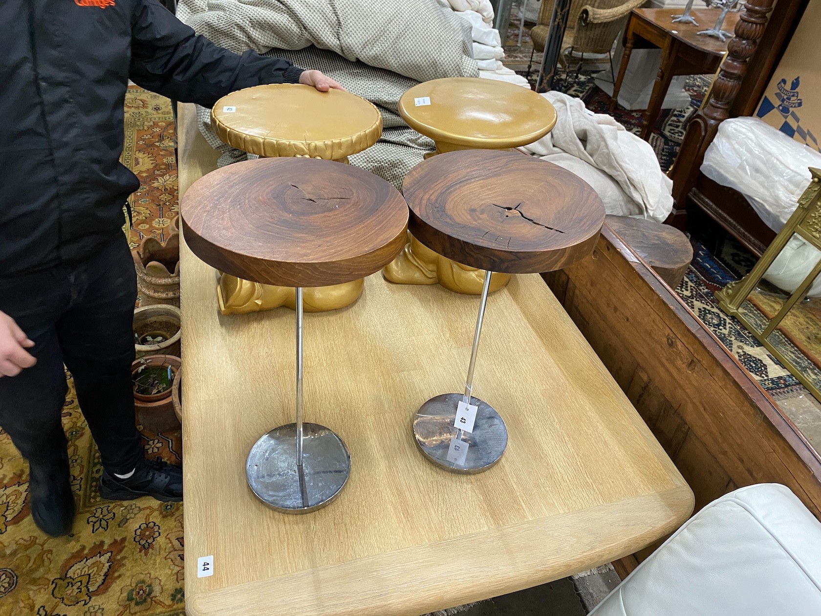 A pair of contemporary hardwood topped steel stands
